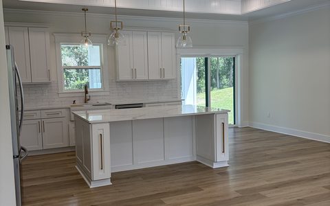 Open kitchen and great room of a new build, cleaned for handover