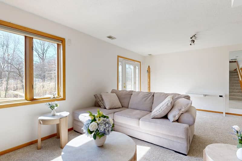 Calm, tidy living room kept comfortable for an older adult